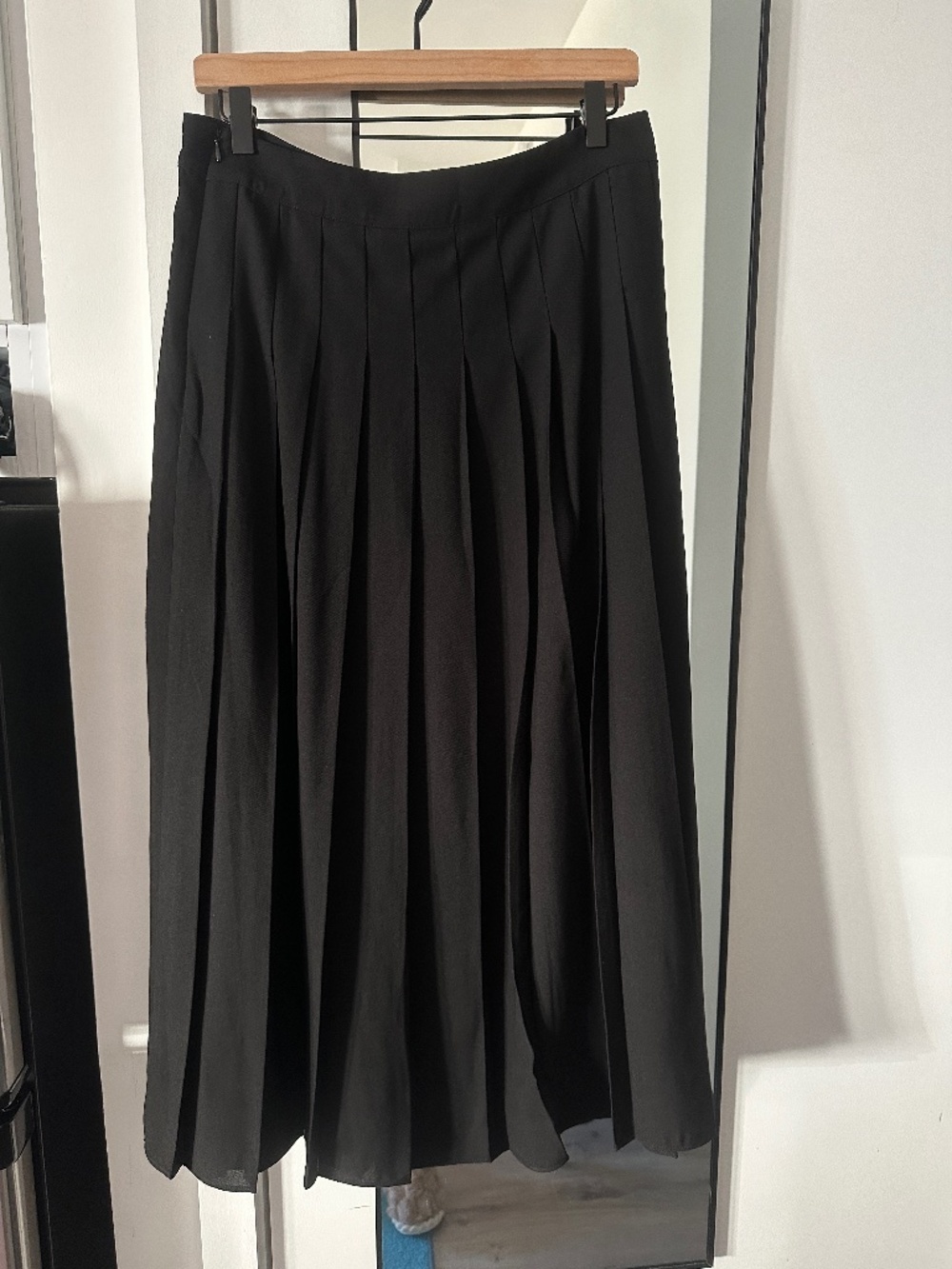 Pleated black midi skirt